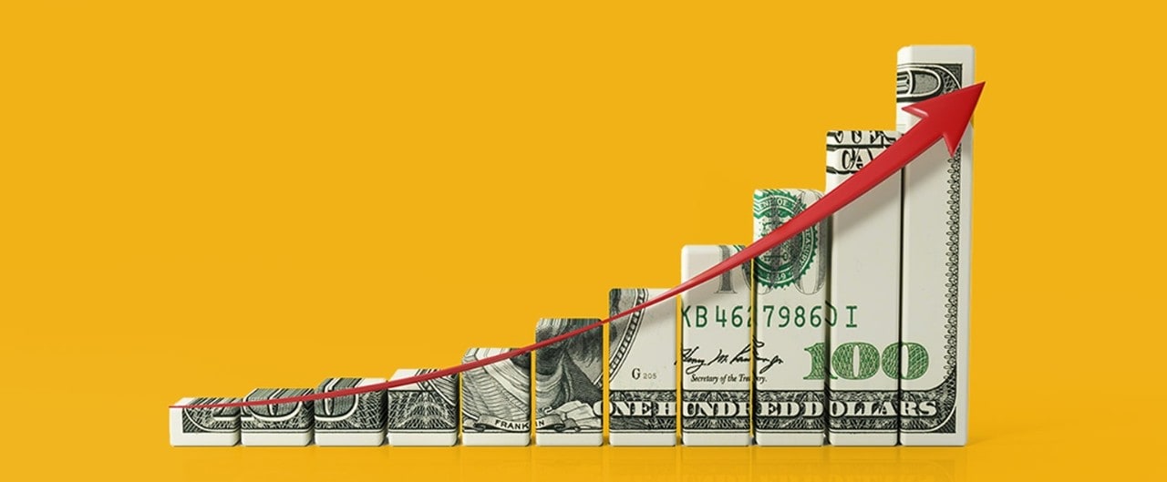 Bar graph made of $100 bill with red upward arrow illustrating growth