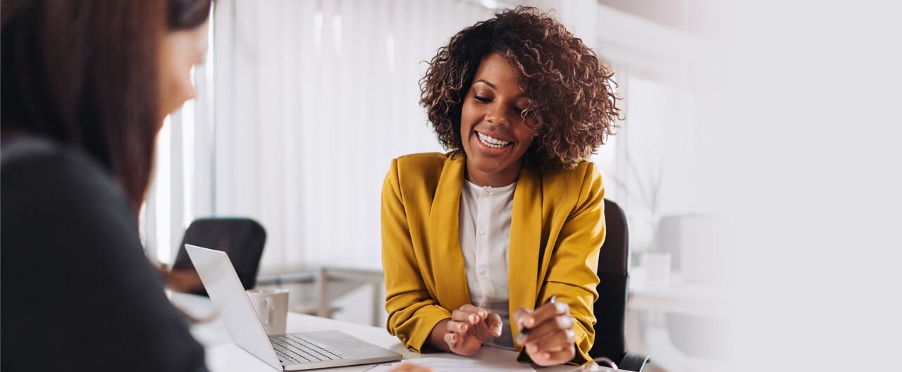 African-American female banker meeting with client