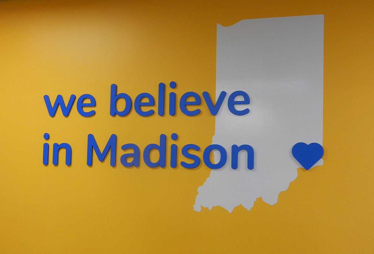 Mural reading "we believe in Madison" with a heart over an image of the state of Indiana