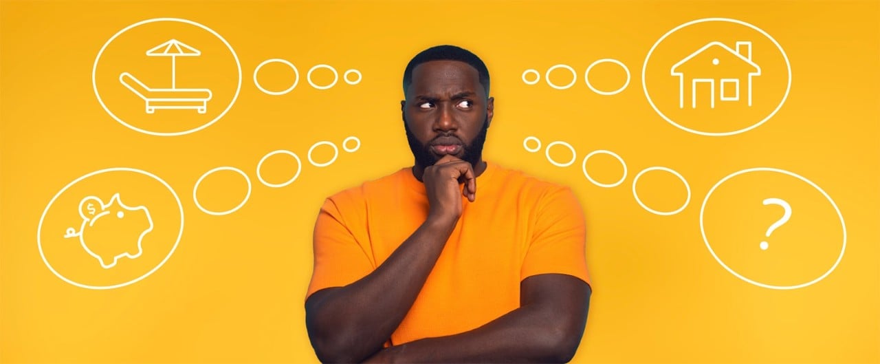 African-American man with confused look standing in front of thought bubbles including lounge chair, piggy bank, house and question mark