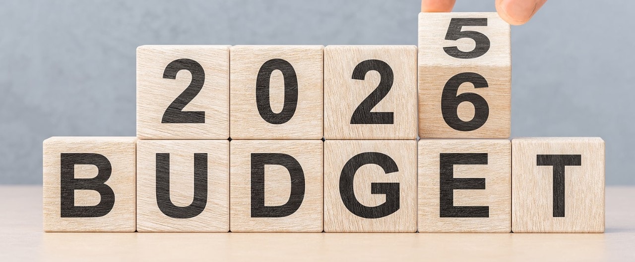 blocks with 2025 budget being turned to show 2026