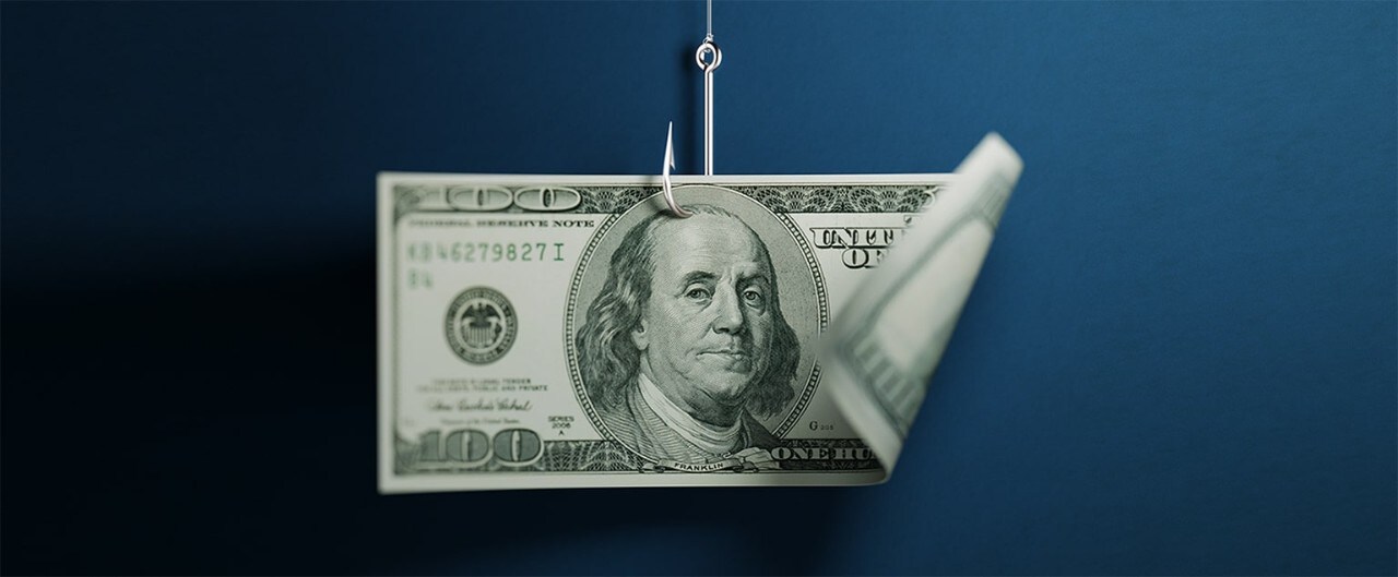 One hundred American dollar banknote on blue background. American dollar banknote is hooked by a fishing hook. Horizontal composition with selective focus and copy space. Great use for American dollar currency and financial concepts.