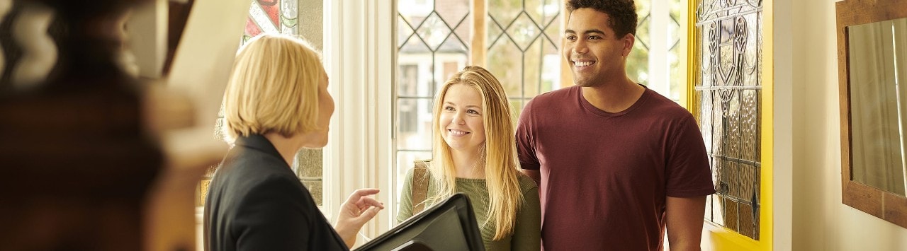 Realtor shows mixed race couple a home. 