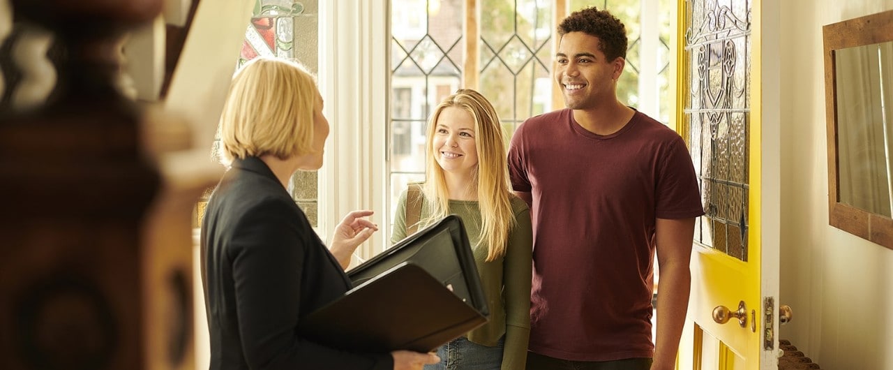 Realtor shows mixed race couple a home. 