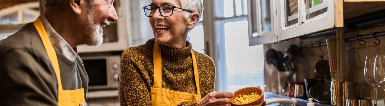 Older Caucasian couple preparing Thanksgiving dinner