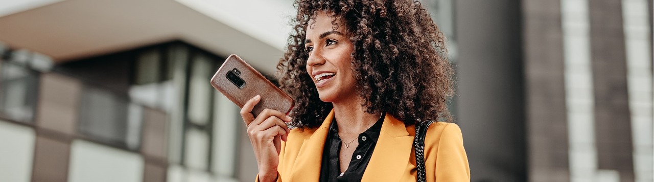 African-American woman speaking on smartphone