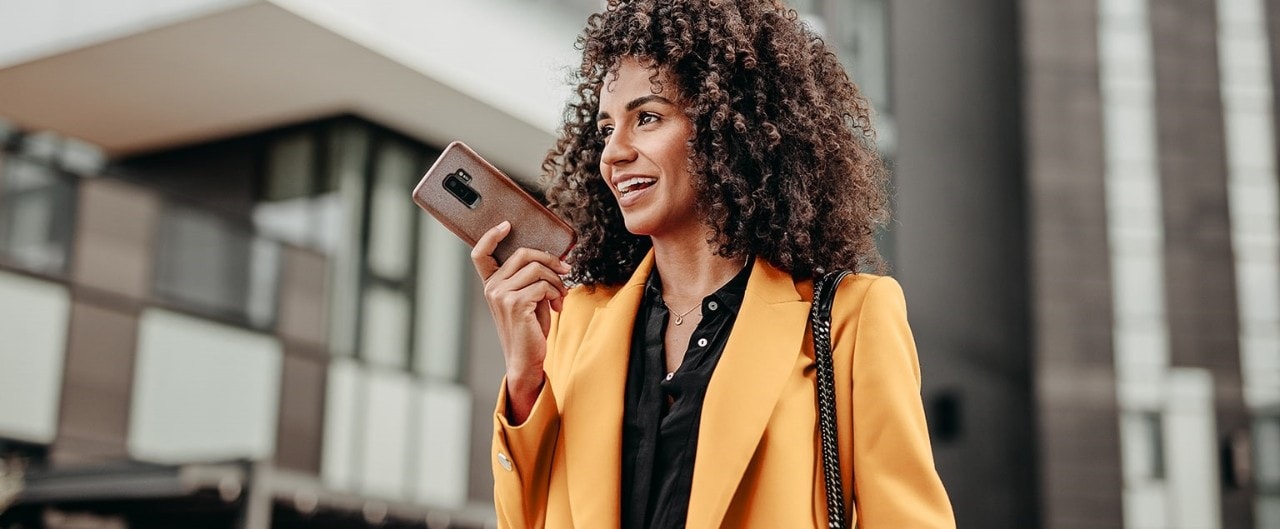 African-American woman speaking on smartphone