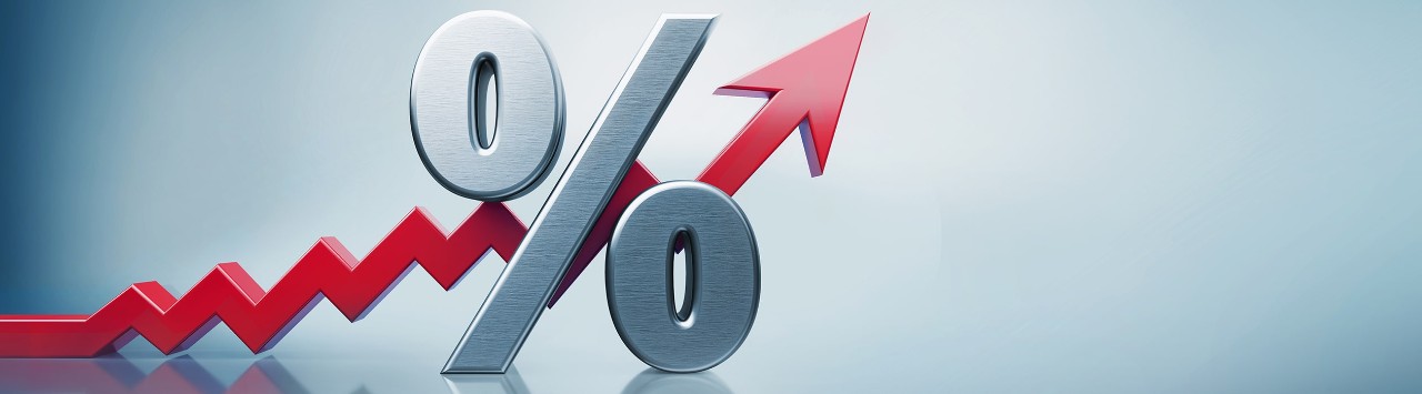 Upward-trending red arrow behind a percent sign