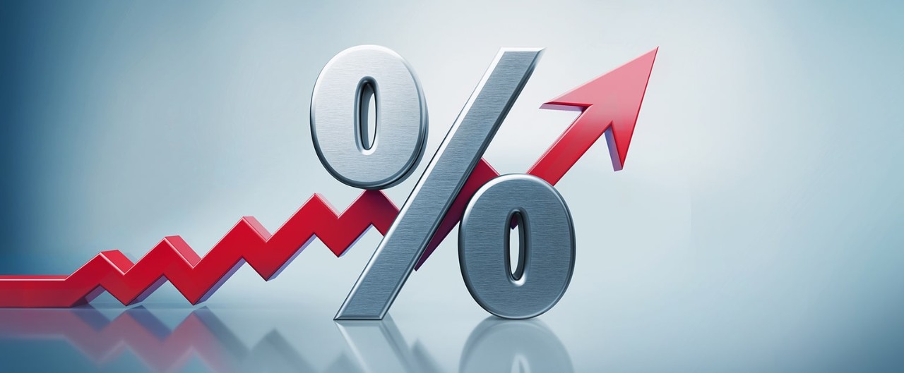 Upward-trending red arrow behind a percent sign