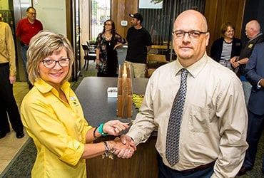 Woman and man shaking hands