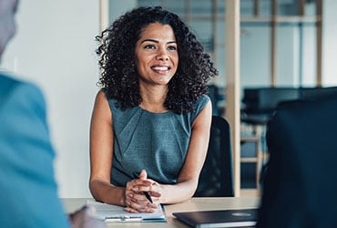 Female wealth advisor meeting with clients